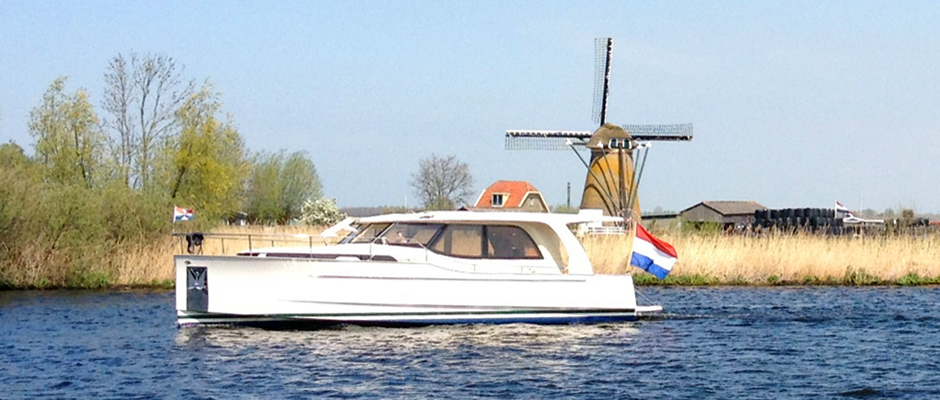 Dutch motorboat on lake in South Holland Netherlands