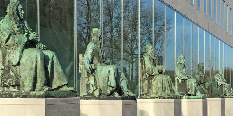 statues of Dutch judges outside the Netherlands Supreme Court building in The Hague Netherlands