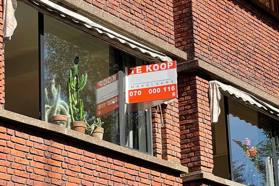 Netherlands property te koop for sale sign in window